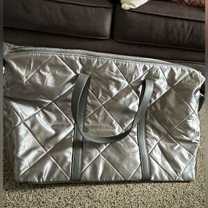 Silver quilted duffle.